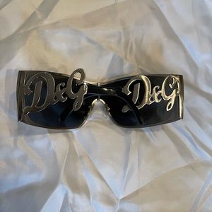 Dolce and Gabbana brushed nickel shields with original case- a Y2K must have.